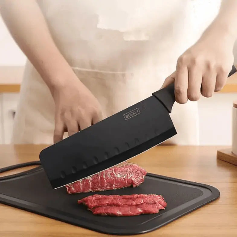 8 Pieces Knife Set - 8 Piece Knife Set | Razor-Sharp Knives Combo featuring a black chef knife slicing raw beef on a chopping board, ideal for meal prep.