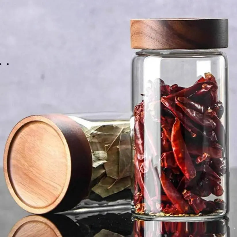 Glass Spice Jars with Wood Lids - Airtight Seal | Buy 2, Get 1 Free displaying two jars filled with bay leaves and dried chilies, emphasizing airtight wooden lids.