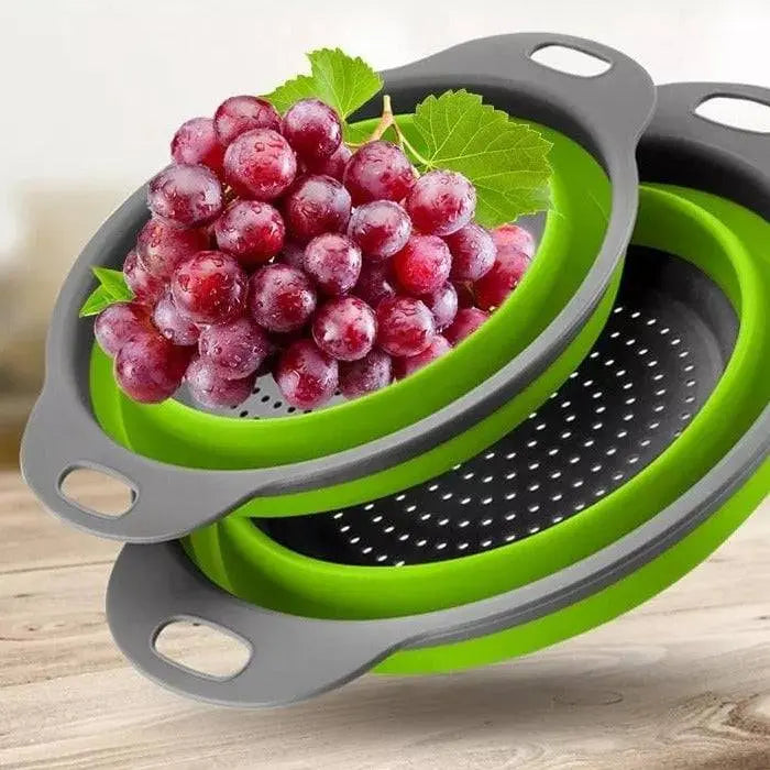 Round Folding Colander stacked with fresh grapes, showcasing its foldable green and gray BPA-free design for easy storage.