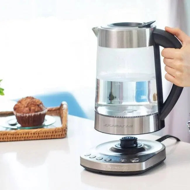 Electric Stainless Steel Kettle - Fast Boiling | Auto Shut-Off, cordless glass kettle lifted from base, modern kitchen setup.