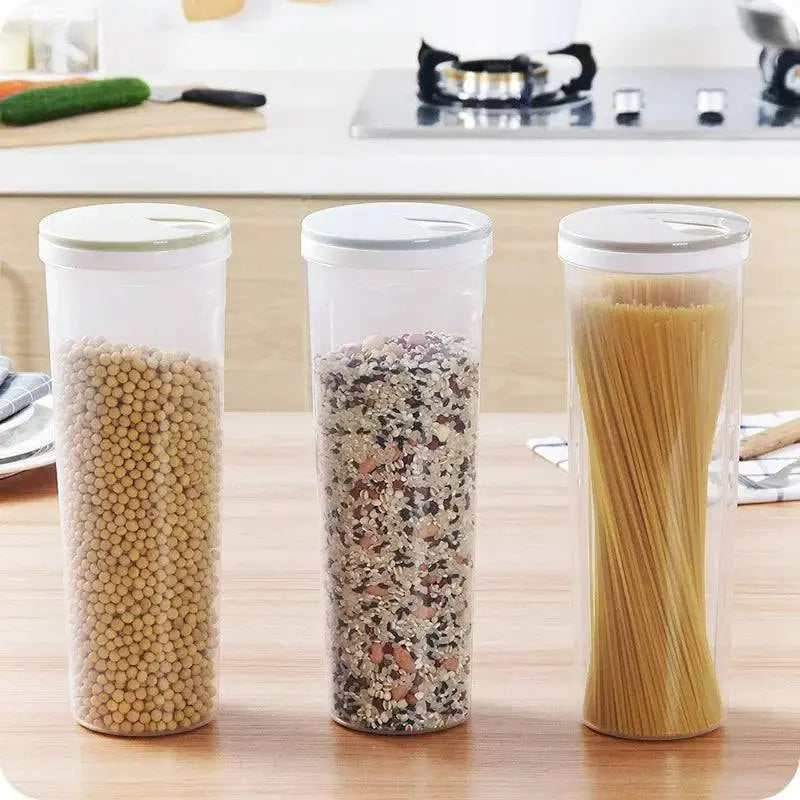 Three Moist-proof Pasta Jars - Airtight Storage | Space Saver filled with pasta, grains, and beans neatly arranged on a kitchen counter.