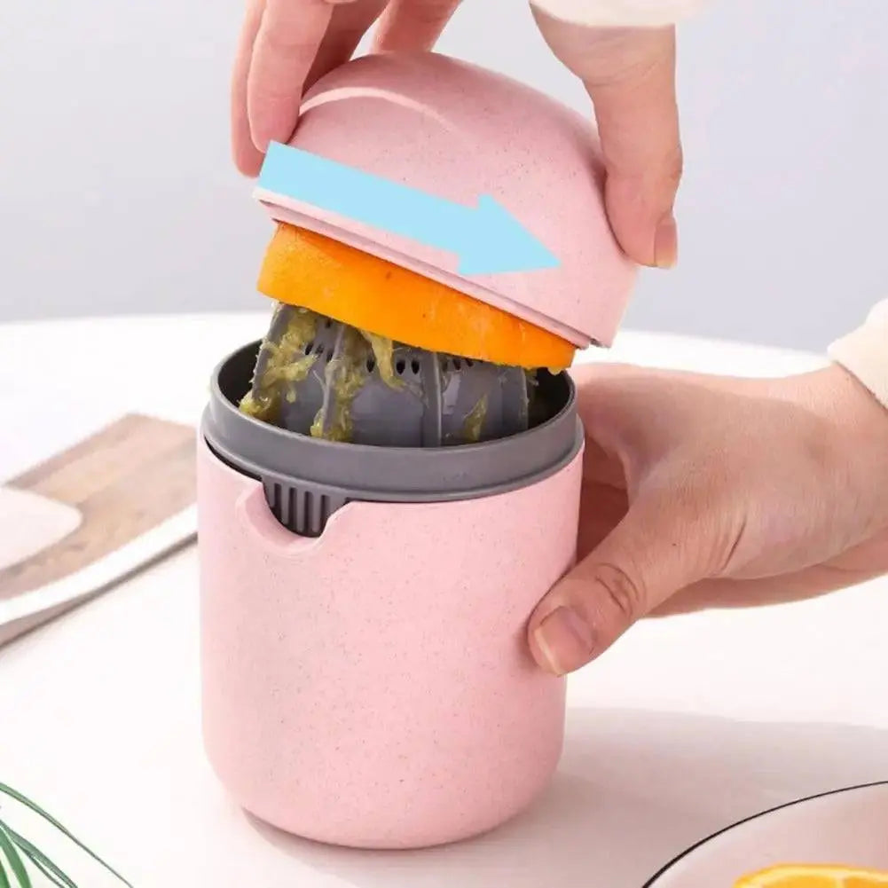 Multifunction Fruit Juice Press - Versatile Juice Extraction | No Waste, Easy Clean, demonstrating orange squeezing with easy twist motion.