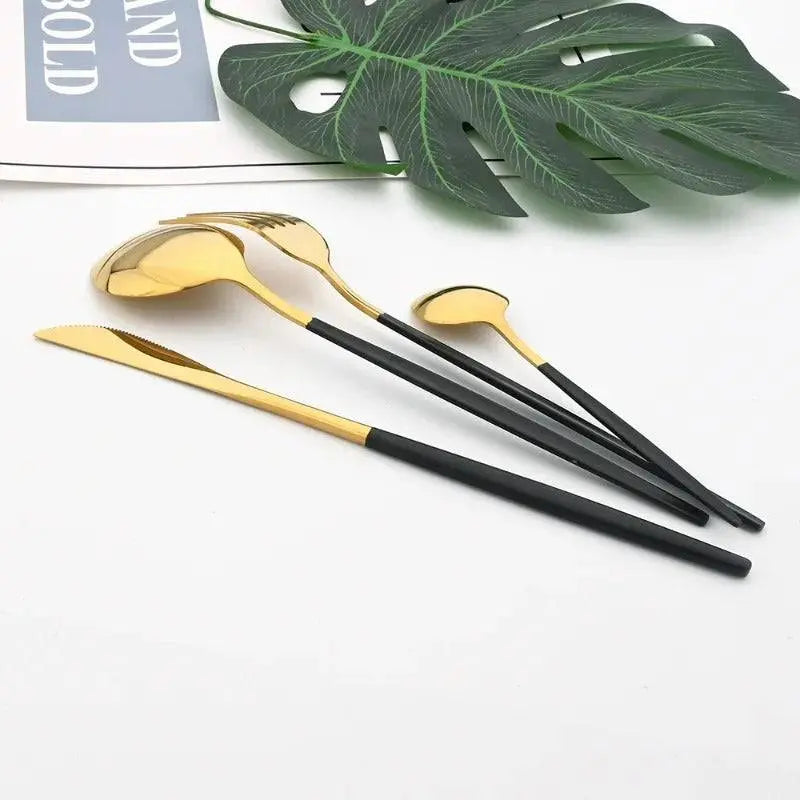 24 Pcs Black Handle Golden Cutlery Set featuring elegant gold-plated utensils with sleek black handles, perfect for upscale dining experiences.