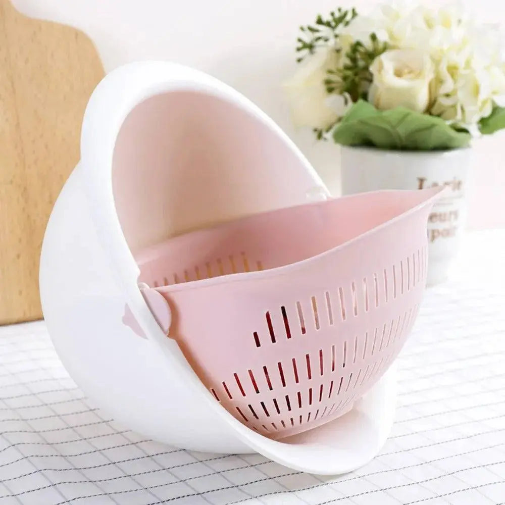 Rotatable Double Drain Basket - Efficient Kitchen Tool in pink and white color, displayed on a kitchen counter for modern kitchens.