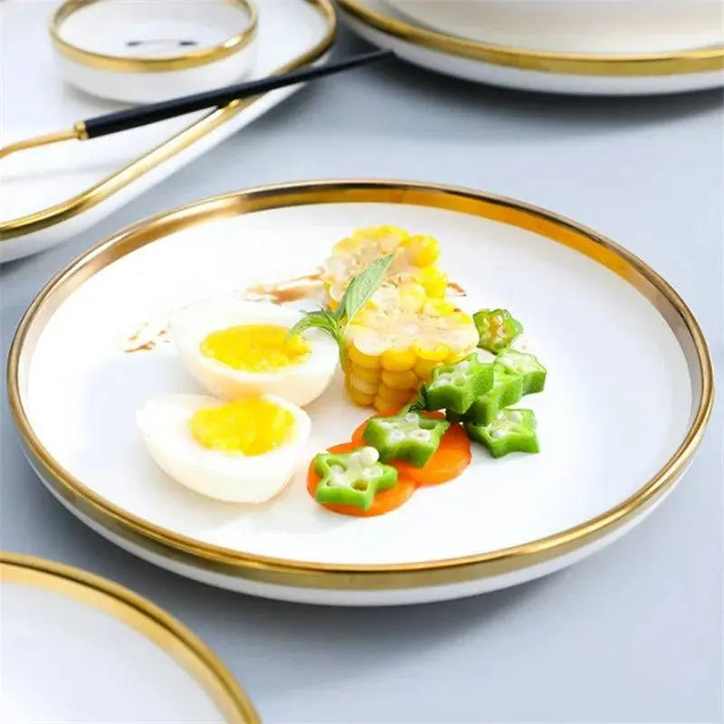 Premier Gold Ceramic Dinnerware Set - Elegant Dining | 12-Piece showcasing a white plate with gold rim, served with eggs, corn, and vegetables.