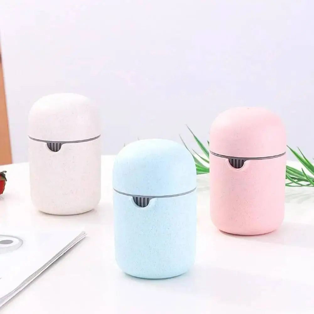 Multifunction Fruit Juice Press - Versatile Juice Extraction | No Waste, Easy Clean, displayed in pastel colors pink, blue, and white.