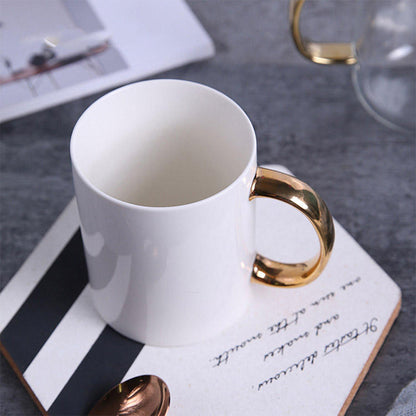 Elegant Coffee Cup with Gold Handle